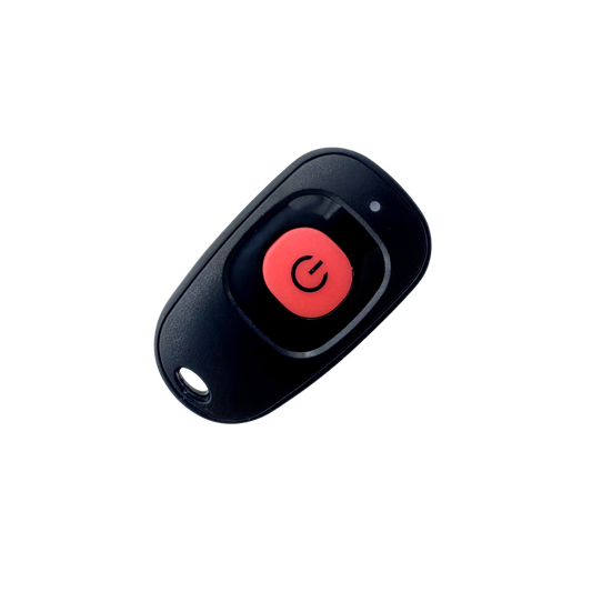 Black remote control with a red button on a white background
